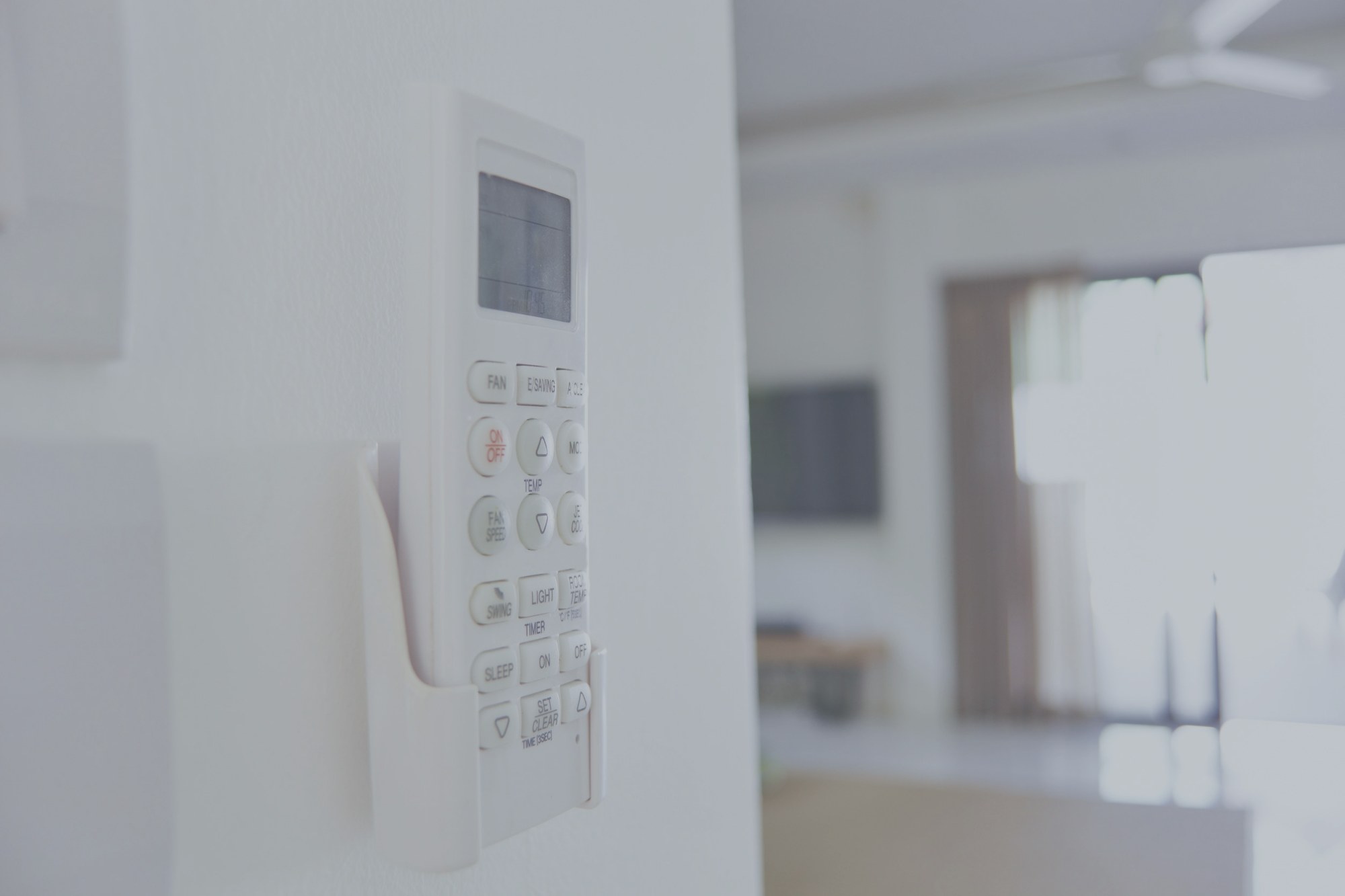 AC remote on wall
